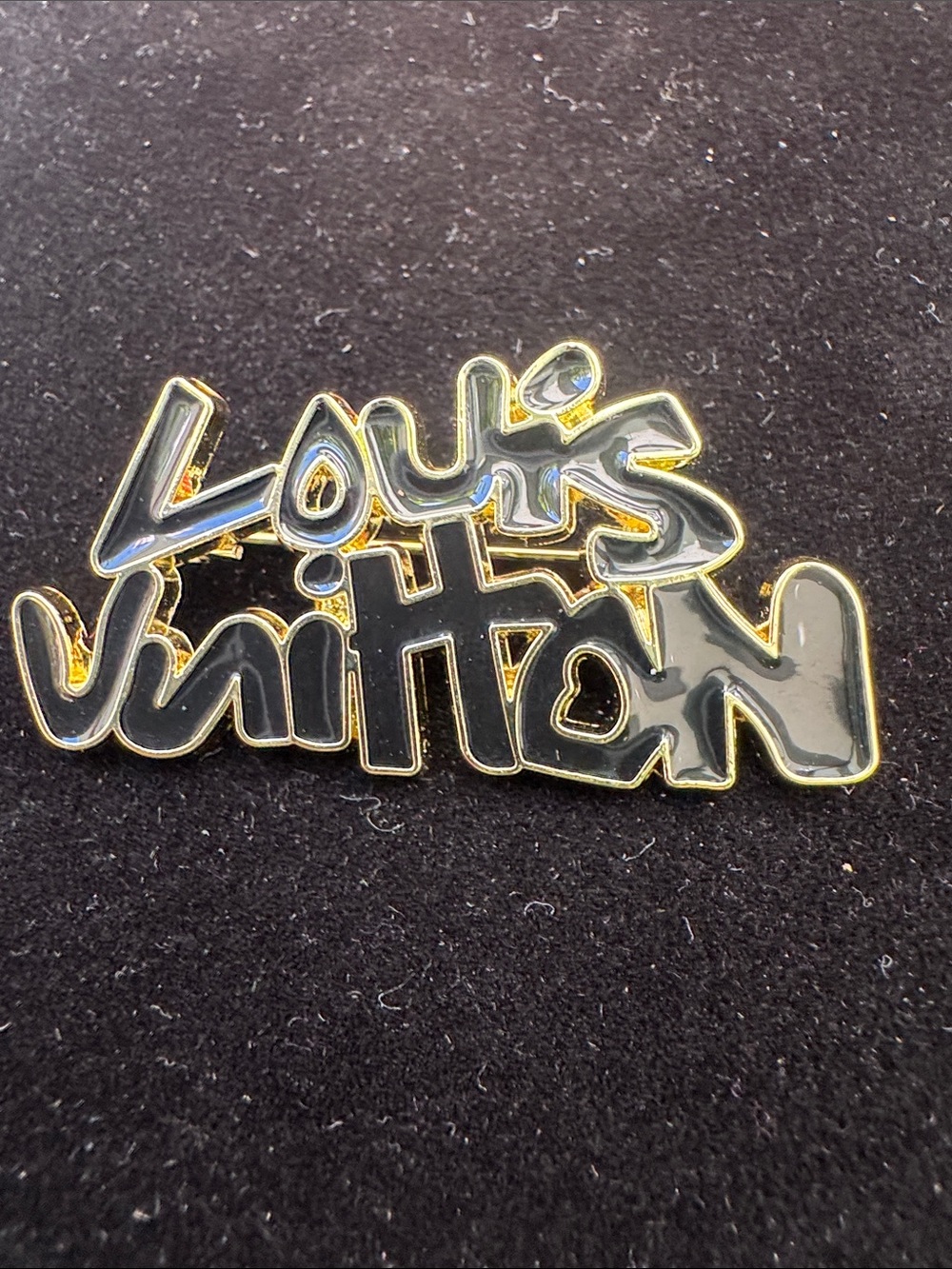 Brooch, graffiti